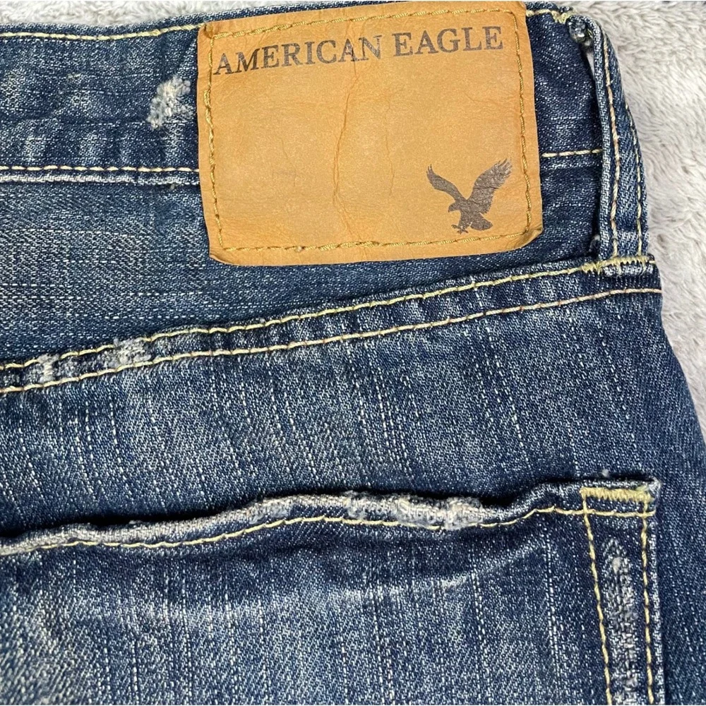 American Eagle Jeans Men Size 34 Low Rise Boot Cut Blue Denim Distressed Casual